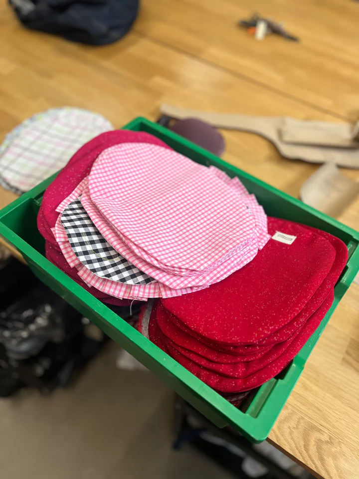 Cut up clothes in red and check patterns for the beginnings of Stoma covers